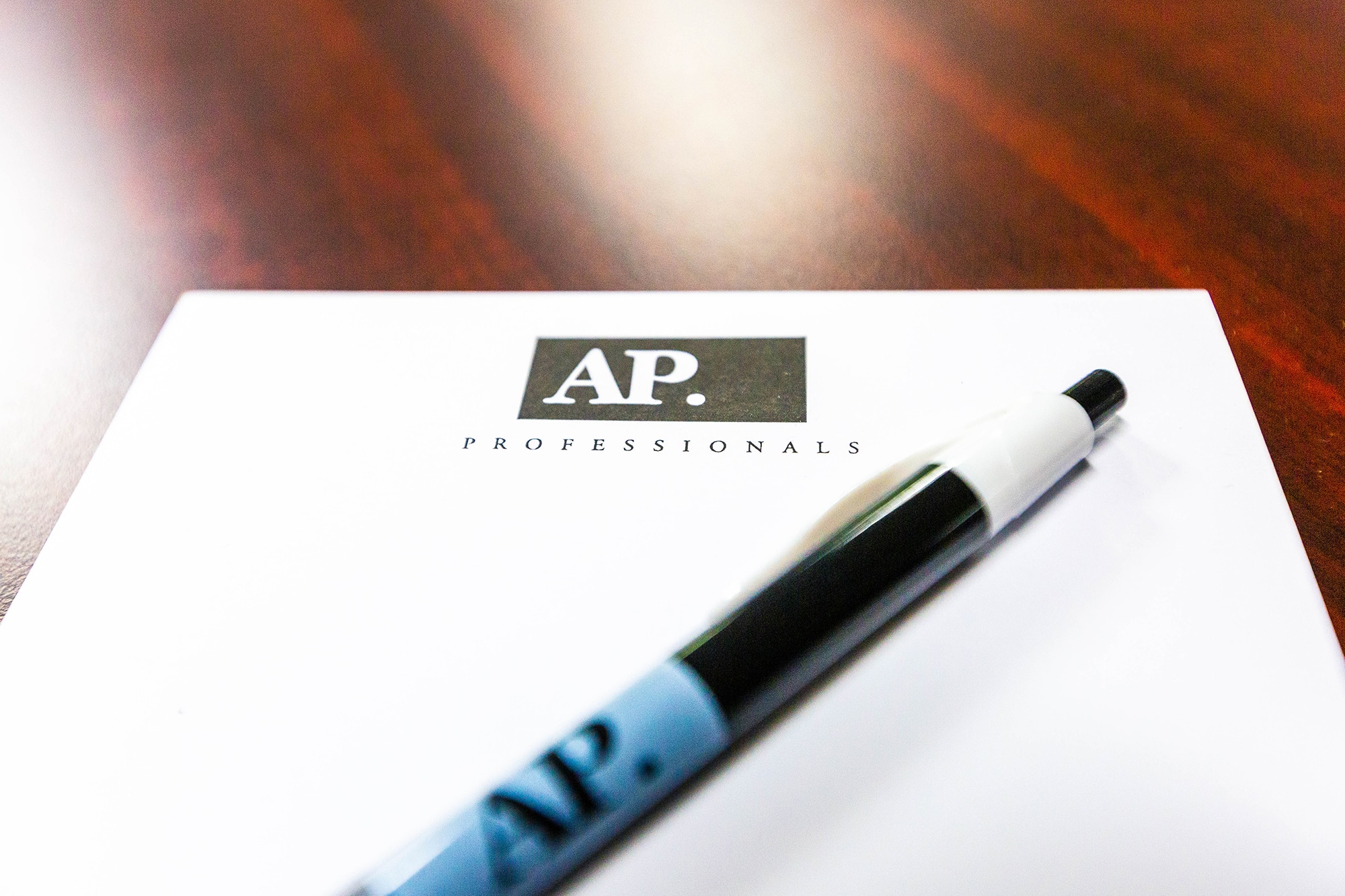 AP Professionals branded notepad