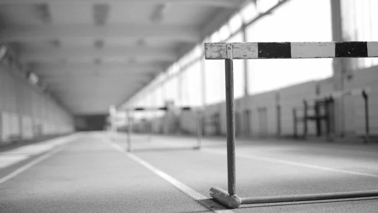 Image of a hurdle on an indoor running track.